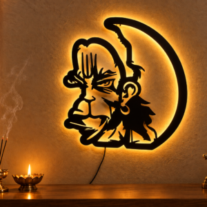 Black metal Hanuman wall art featuring Lord Hanuman’s face and circular design, displayed with dimensions 24 × 2 × 24 inches and weight 1.330 kg.