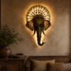 Decorative elephant face wall art with an ornate golden crown and traditional Indian detailing, displayed in a rustic stylish living room.
