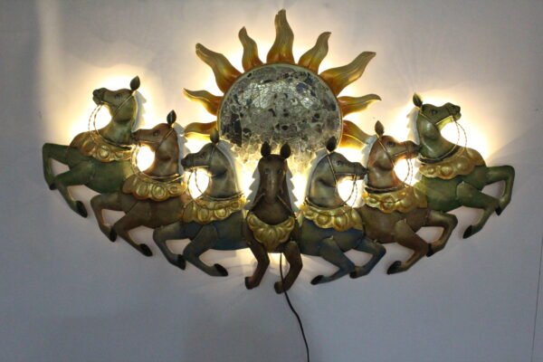 Decorative multicolor metal wall art featuring seven running horses with a large sun design, measuring 46 × 3 × 26 inches.