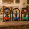 Set of three colorful handcrafted Rajasthani-style metal figurines with traditional turbans and folk-art detailing, displayed in decorative arched frames.