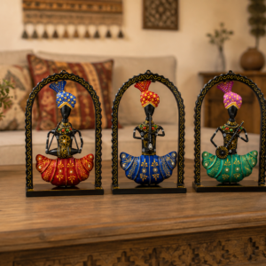 Set of three colorful handcrafted Rajasthani-style metal figurines with traditional turbans and folk-art detailing, displayed in decorative arched frames.