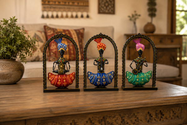 Set of three colorful handcrafted Rajasthani-style metal figurines with traditional turbans and folk-art detailing, displayed in decorative arched frames.