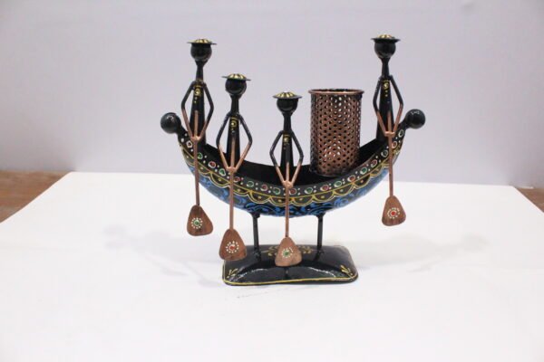 Set of three colorful handcrafted Rajasthani-style metal figurines with traditional turbans and folk-art detailing, displayed in decorative arched frames.