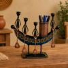 Set of three colorful handcrafted Rajasthani-style metal figurines with traditional turbans and folk-art detailing, displayed in decorative arched frames.