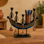 Set of three colorful handcrafted Rajasthani-style metal figurines with traditional turbans and folk-art detailing, displayed in decorative arched frames.