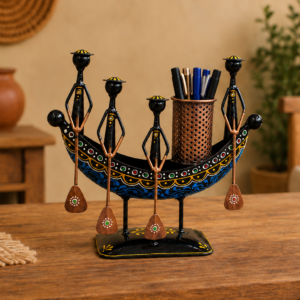 Set of three colorful handcrafted Rajasthani-style metal figurines with traditional turbans and folk-art detailing, displayed in decorative arched frames.